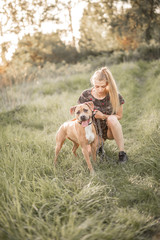 Fototapeta premium Girls playing around in nature and dogs