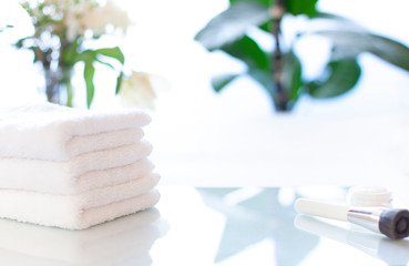 Spa or bathroom concept close up with bath towels on the table. Selective focus. Copy space