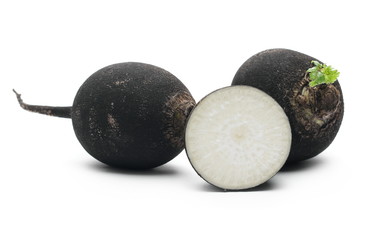 Black radish with slices isolated on white background