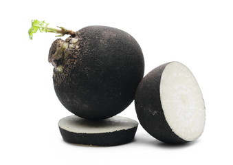 Black radish with slices isolated on white background