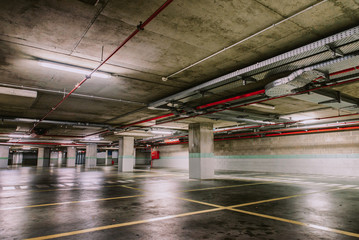 Empty underground parking lot industrial background