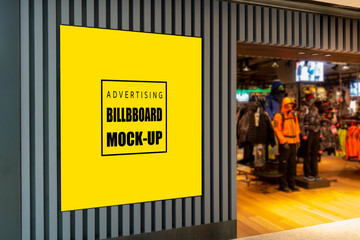 Mock up advertising billboard at front of clothing shop
