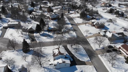 Aerial view of residential houses at winter. American neighborhood, suburb. Real estate, snow, drone shots, from above