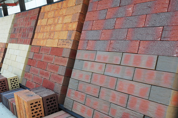 Stacks of different bricks for sale in the constuction market.