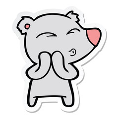 sticker of a cartoon whistling bear