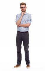 Full length portrait of young man standing on white background