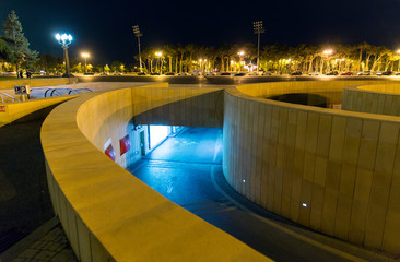 Entry and exit from the underground car parking. Night view