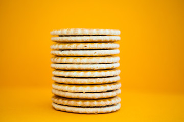 Pile of cookies on a yellow ground