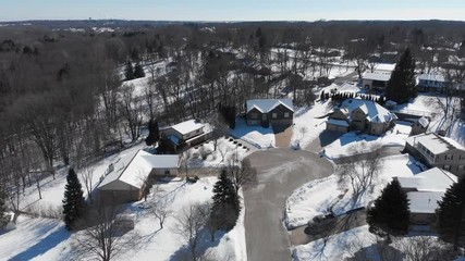 Aerial view of residential houses at winter. American neighborhood, suburb. Real estate, snow, drone shots, from above