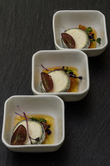 Buck goat cheese in ash with orange confit and strawberry