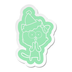 cartoon  sticker of a cat wearing santa hat