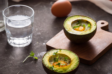 Homemade Organic Egg Baked in Avocado with Salt and Pepper