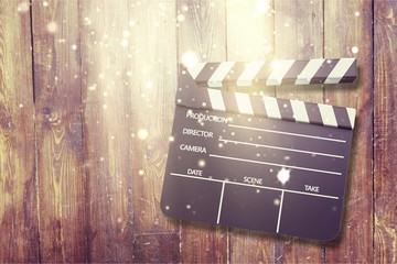 Clap board on wooden background