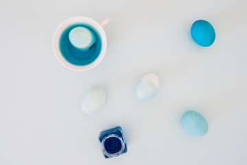 Top view of colorful easter eggs on white background