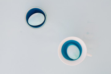 Top view of colorful easter eggs on white background