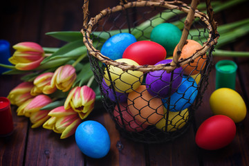 Easter background with tulips and painted eggs 