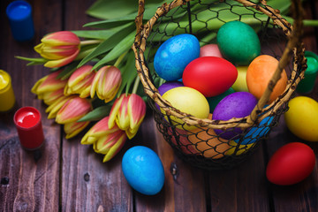 Easter background with tulips and painted eggs 