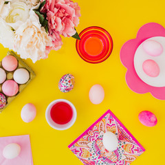 Easter eggs pink on yellow background