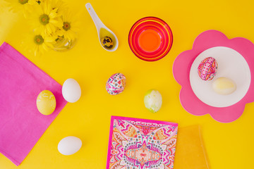 Easter eggs pink on yellow background
