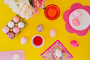 Easter eggs pink on yellow background