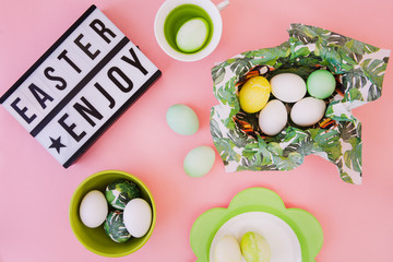 Easter letters with easter eggs on pink background