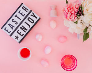 Easter eggs pastel colors on pink background