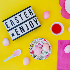 Easter eggs pink on yellow background