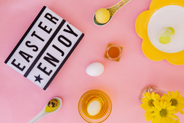 Easter letters with easter eggs on pink background