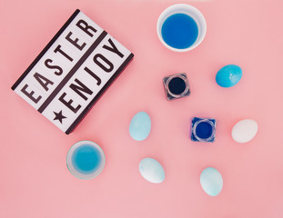 Easter letters with easter eggs on pink background