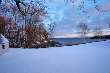 Snow landscape and sunrise in Bar Harbor, Maine. The water view is of Mt. Desert Narrows. Photographed on March 12, 2019.