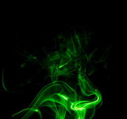 Obraz premium Green smoke on black background
