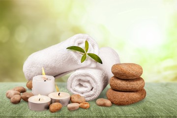 Spa concept with zen basalt stones and towels