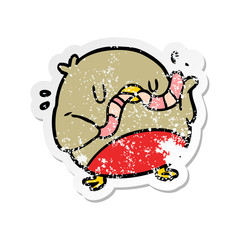 distressed sticker of a cartoon robin with worm