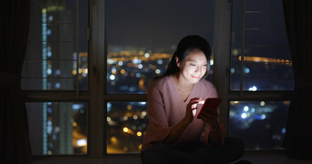 Woman use of mobile phone online