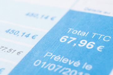 closeup of amount in euro money with taxes on french bill document