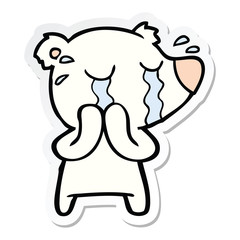sticker of a cartoon crying polar bear