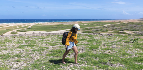 Girl hiking in the coastline