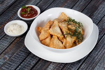 Chebureks. Traditional meat dish of the peoples of Central and Central Asia, rice, meat and onions, suitable for the Nauryz or Navruz holidays, as well as during the Holy month of Ramadan and the holi