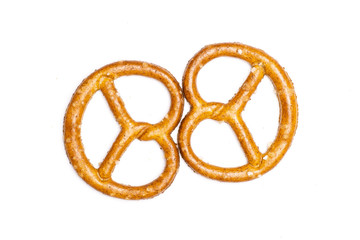 Group of two whole mini salted pretzels flatlay isolated on white background