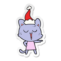 sticker cartoon of a cat singing wearing santa hat
