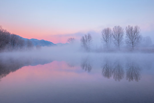 Foggy sunrise on Adda river, Airuno, Brianza, Lecco province, Lombardy, Italy, Europe - Powered by Adobe