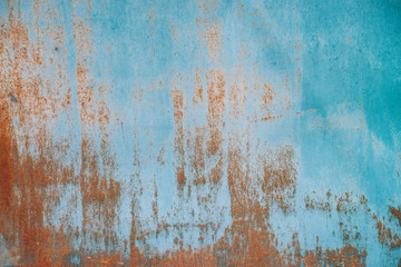Rust on metallic surface. Iron texture. Partly rusty background. Rough oxide plate close-up. Hard...