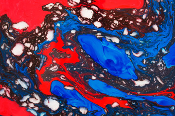 Abstract beautiful mramirovanie colored inks technique Ebru.Ebru style Oriental drawing on water with acrylic paints on water movement curls.A stylish mix of natural luxury 