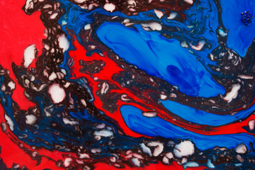 Abstract beautiful mramirovanie colored inks technique Ebru.Ebru style Oriental drawing on water with acrylic paints on water movement curls.A stylish mix of natural luxury 