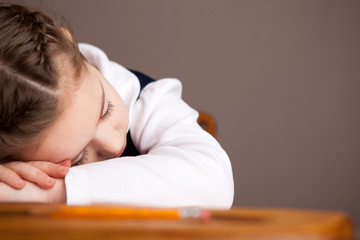 Tired Little Girl Sleeping in Old School Desk