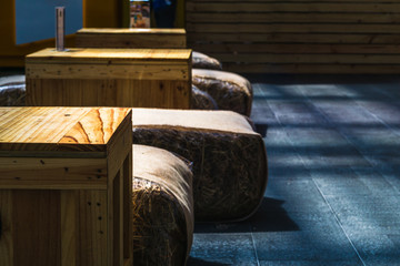 Relax and chill out background. Straw chair and recycling pallets wooden table for party outdoor. Recycled background concept. 