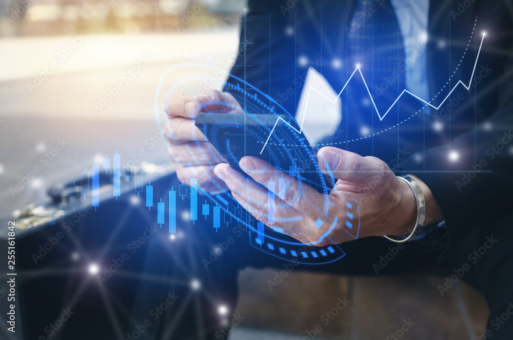 Wall mural young investor or business man using mobile phone with graphic global network connection and graph c