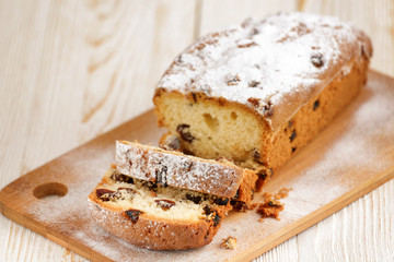 Delicious homemade cake with raisins on a light wooden background. close-up. rustic. copy space.
