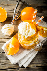Orange Soda Creamsicle cocktail. Ice Cream and orange smoothie. Dreamsicle drink. Rustic wooden background copy space