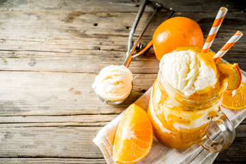 Orange Soda Creamsicle cocktail. Ice Cream and orange smoothie. Dreamsicle drink. Rustic wooden background copy space